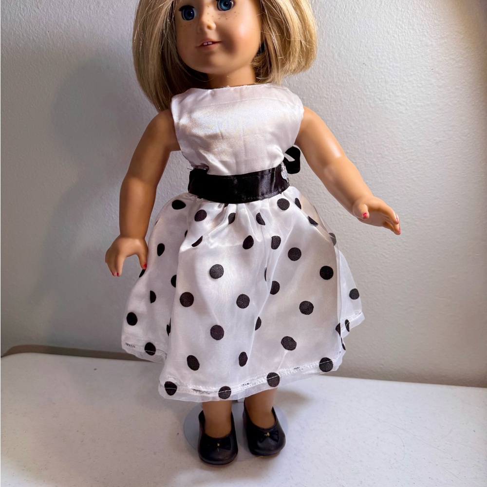 Handmade white formal dress with black polka dots
Fits 18” dolls